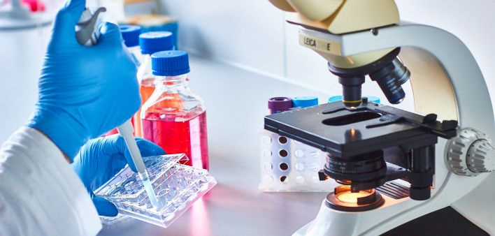 A background showing educational materials or a classroom setting